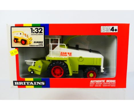 Britains - Unsold shop stock - A boxed Claas Jaguar 690 Forage Harvester # 9573. The model appears Mint in a Very good box wi