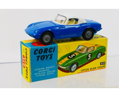 Corgi Toys - A boxed Corgi Toys #Elan Coupe. The model with blue body, white roof, cream interior and cast hubs, has a couple