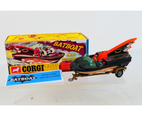 Corgi Toys - A boxed Corgi Toys #107 Batboat. The Batboat comes with the two figures and features a tinplate fin and deck cov