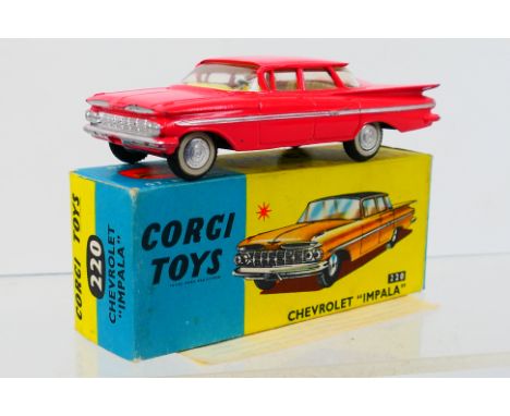 Corgi Toys - A boxed Corgi Toys #220 Chevrolet Impala. The model with pink body, and lemon interior, has a few small marks ma