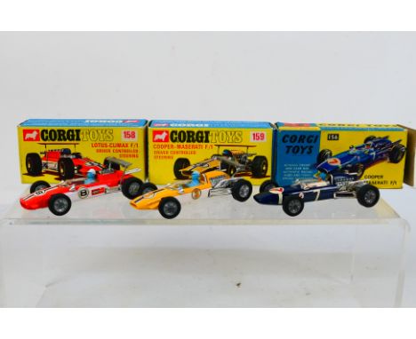 Corgi Toys - Three boxed Corgi Toys racing cars. Lot consists of #156 Cooper Maserati F1; #158 Lotus Climax F1; and #159 Coop