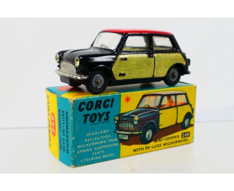 Corgi Toys - A boxed Corgi Toys #249 Mini-Cooper With De-Luxe Wickerwork. The model with black body, red roof, lemon interior