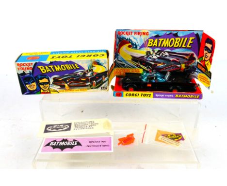Corgi Toys - A boxed Corgi Toys #267 Batmobile. The model with gloss black body, orange 'Bat' logo on doors, with gold cast h