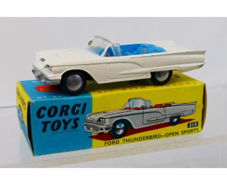 Corgi Toys - A boxed Corgi Toys #215 Ford Thunderbird (Open Sports). The model in white with blue interior and spun hubs, has