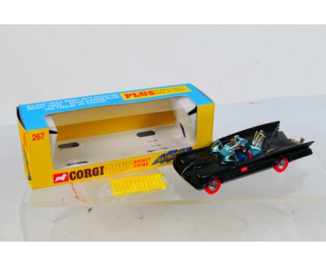 Corgi Toys - A boxed Corgi Toys #267 Batmobile with red whizz wheels. The model is restored to an Excellent standard appearin