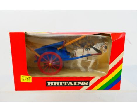 Britains - Unsold shop stock - A boxed 1980 Britains Tumbrel Cart # 9499. The model appears Mint in a Good box with some ligh