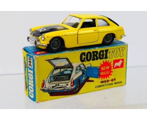 Corgi Toys - A boxed Corgi Toys #345 MGB GT Competition Model. The model with yellow body, black bonnet, tailgate, with black