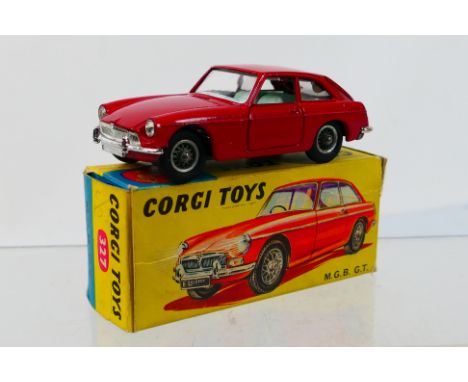 Corgi Toys - A boxed Corgi Toys #327 MGB GT. The model in dark red with wire wheels and light blue interior appears to be in 