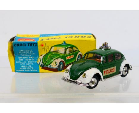 Corgi Toys - A boxed Corgi Toys #492 Volkswagen European Police Car. The model with green body and white wings with red inter