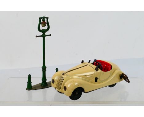 Schuco - A clockwork Schuco Examico Roadster # 4001. The model shows some signs of use and there is no windscreen with it. Th