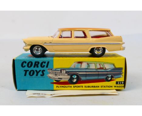 Corgi Toys - A boxed Corgi Toys #219 Plymouth Sports Suburban Station Wagon. The model in cream with fawn roof, red interior 