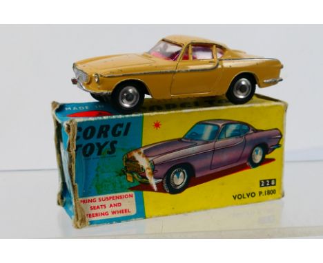 Corgi Toys - A boxed Corgi Toys #228 Volvo P1800. The model in beige, with red interior and spun hubs, shows signs of play wi