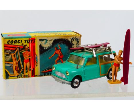 Corgi Toys - A boxed Corgi Toys #485 Mini Countryman with Surfer. The model in sea-green body, lemon interior 2 surf-boards o