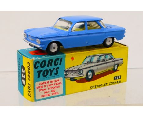 Corgi Toys - A boxed Corgi Toys #229 Chevrolet Corvair. The model in powder blue with lemon interior, Venetian blind to rear 