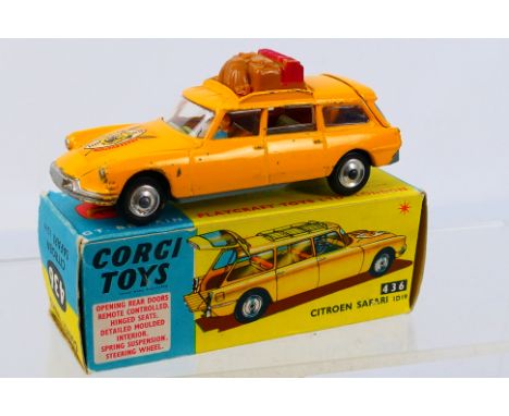 Corgi Toys - A boxed Corgi Toys #436 Citroen Safari ID19. The model in yellow with driver and passenger and luggage has some 