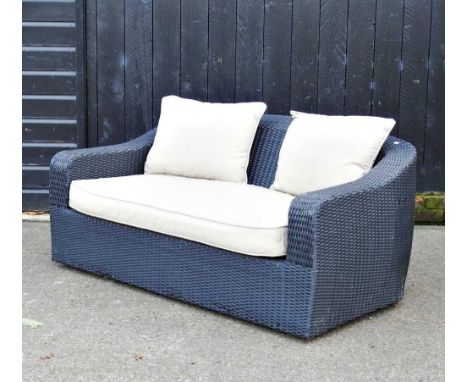 A rattan garden sofa, with loose cushions147w x 90d x 70hcm 
