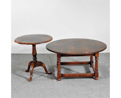 An oak circular occasional table, together with another, on a tripod base (2)