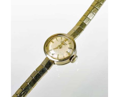 A Longines 9 carat gold cased ladies wristwatch, the signed dial with baton hours, on a flexible strap, 13g