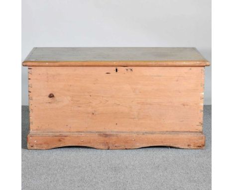 An antique pine trunk, with a hinged lid107w x 56d x 53h cm
