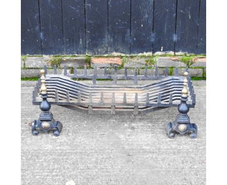 A cast iron fire grate, 92cm wide, together with a pair of andirons (3)