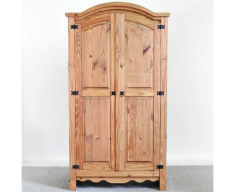 A modern pine double wardrobe, enclosed by panelled doors103w x 57d x 189h cm