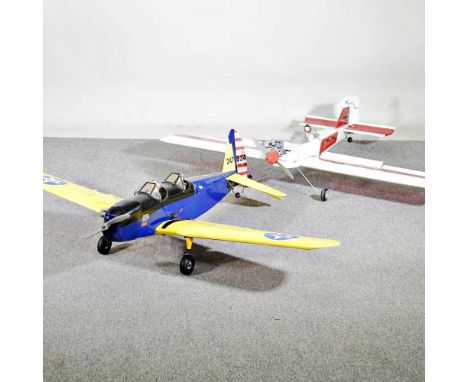 A radio controlled model plane, together with another, 150cm wide (2)