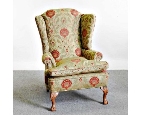 A George I style floral upholstered wing armchair, 20th century, on claw and ball feet78w x 87d x 113h cmOverall condition lo