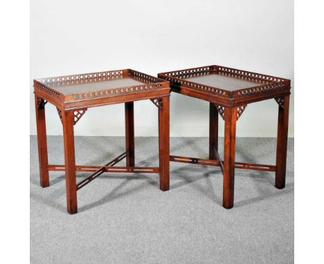 A pair of mahogany Chippendale style side tables, 20th century, each having a pierced gallery (2)62w x 47d x 64h cm