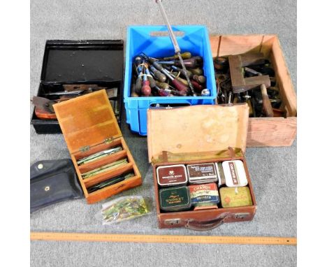 A collection of workshop hand tools, together with a case of tins