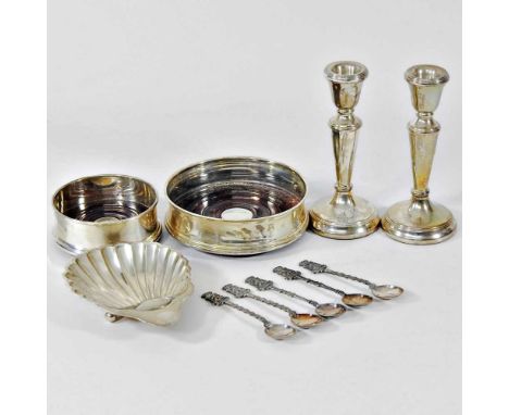 A pair of modern silver table candlesticks, together with a silver shell shaped butter dish, various spoons and two silver wi