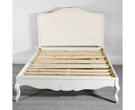 A white painted double bedstead, with a slatted wooden base145w x 207d x 124h cm