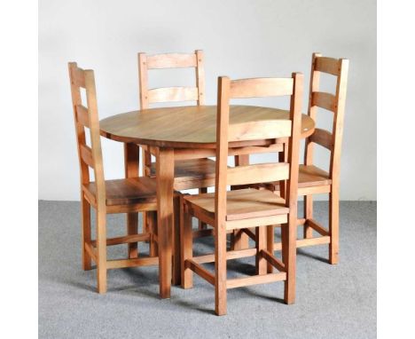 A modern circular light oak dining table, together with a set of four ladder back dining chairs (5)109w x 79h cm