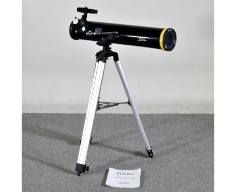 A modern telescope, 700mm, on  a tripod stand