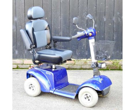 A blue KR600 electric mobility scooter, with charger