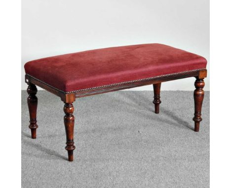 A large Edwardian red upholstered footstool, on turned legs91w x 47d x 47h cm