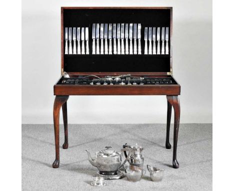A table canteen of silver plated cutlery, with twelve place settings, 77cm, together with a silver plated tea service77w x 47