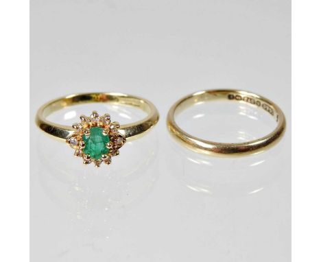 An 18 carat gold, emerald and diamond cluster ring, 2,7g, size M, together with a 9 carat gold wedding band, 1.6g, size K/L (