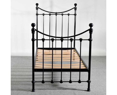 A modern single black painted metal bedstead, with a slatted wooden base