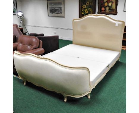 A French style cream upholstered show frame double bedstead, with a fabric base, 150cm wide