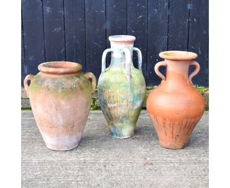 A terracotta amphora garden pot, 63cm high, together with two others smaller (3)