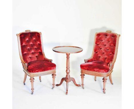 A pair of 19th century continental carved walnut and red upholstered side chairs, each having a button back and sphinx suppor