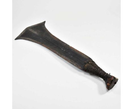 An African carved wooden tribal konda knife, the flared blade, with punched decoration, having a bound wooden grip, 47cm long