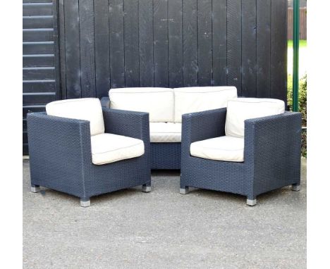 A rattan garden sofa, together with a pair of matching armchairs, with cream cushions (3)146w x 75d x 69hcm