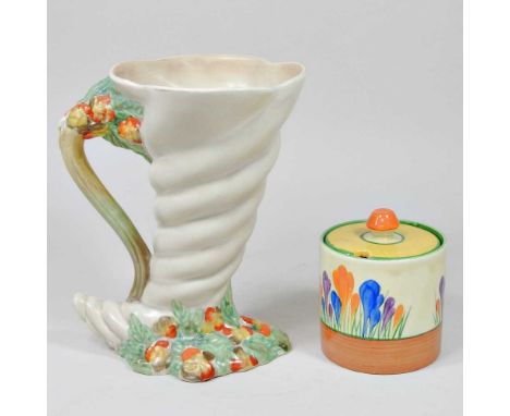 A Clarice Cliff Crocus pattern preserve jar and cover, together with a Clarice Cliff jug (2)Condition is basically complete. 