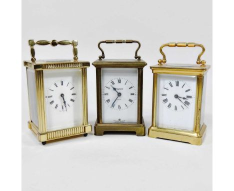 A French brass cased carriage clock, with a white painted dial, 11cm high, together with two others (3)