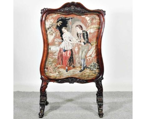 A Victorian mahogany tapestry fire screen, on a splayed base64w x 52d x 114h cm