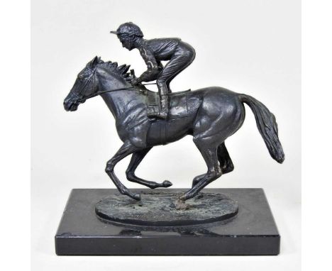 A bronze model of a jockey on a racehorse, signed David Cornell 1985, on a marble base, 20cm highRepaired to foot