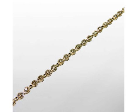 A 9 carat gold and champagne diamond set tennis bracelet, 6g, 18cm long, boxed