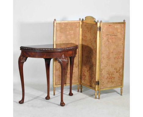 An early 20th century folding card table, on paw feet, together with a gilt three fold screen (2)