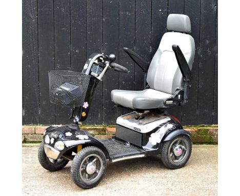 A Sterling electric mobility scooter, with charger